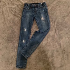 Adorable girls ripped blue jeans!